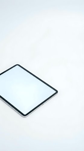 Modern tablet computer with blank white screen on clean white background for digital mockup and app presentation designs.