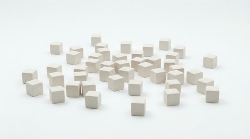 Scattered white and beige wooden cubes on clean background for minimalist design projects, presentations, and creative layouts.