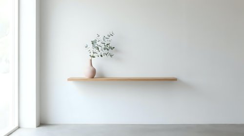 Wooden shelf with potted plant and dried greenery on white wall, minimalist interior design and home decor.