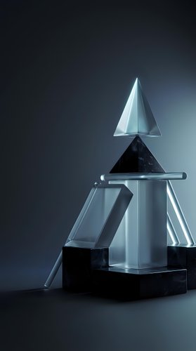 Modern glass crystal awards and trophies arranged on dark surface with dramatic lighting for corporate recognition and achievement ceremonies.