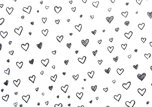 Hand drawn heart pattern in black and white with scattered dots creates seamless romantic background for valentines cards, wedding invitations and love themes.