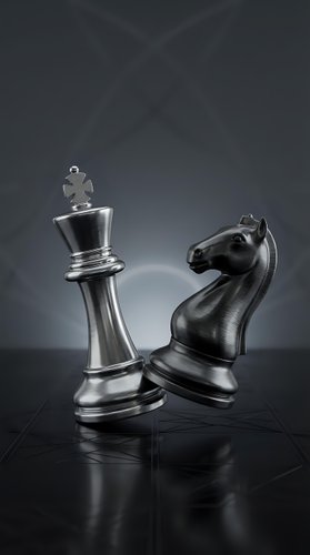 Metallic chess pieces king and knight on dark reflective surface with dramatic lighting for strategic business concepts and competitive thinking.