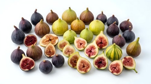 Fresh figs collection with whole and sliced fruits showing red flesh interior on white background. Organic Mediterranean produce for healthy eating.