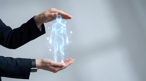Person in dark business suit holding glowing digital human figure between hands, representing artificial intelligence, technology innovation, and future digital transformation concepts.