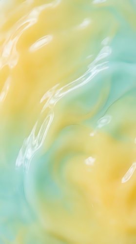 Abstract watercolor background with flowing yellow and turquoise brushstrokes creating organic movement for creative design projects and artistic compositions.