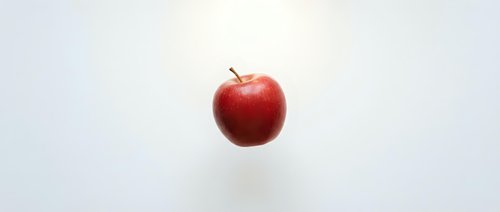 Fresh red apple isolated on white background for healthy eating and nutrition concepts.