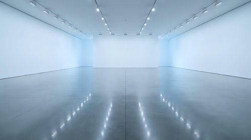Empty modern art gallery interior with white walls and polished concrete floor reflecting ceiling lights for contemporary exhibition space design.