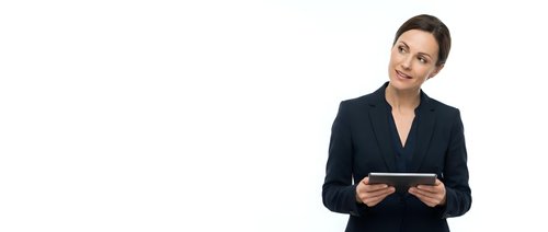Professional businesswoman in dark suit holding tablet computer on white background for corporate presentations and marketing materials.