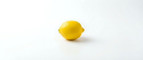 Fresh yellow lemon fruit isolated on clean white background for culinary design projects and healthy food concepts.