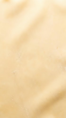 Soft beige textured background with warm neutral tones and subtle light variations, suitable for overlays, web design, and creative projects.