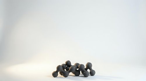 Black olives scattered on white background isolated for culinary design and Mediterranean food concepts.