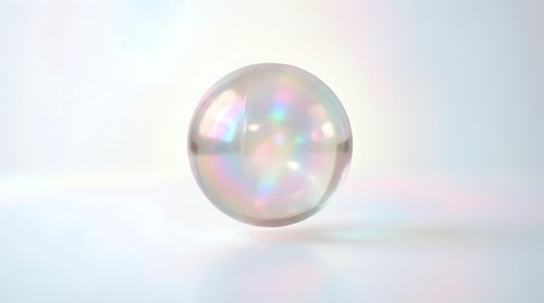 Translucent sphere with iridescent rainbow light reflections on white background, isolated for design, overlay, and digital art projects.