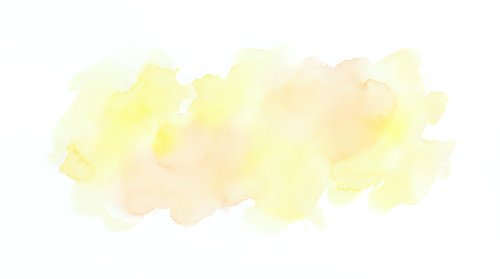 Soft yellow watercolor paint splash with organic flowing texture on white background for artistic design projects and creative layouts.