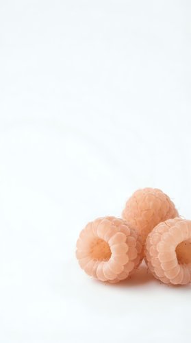 Fresh ripe raspberries isolated on white background with copy space for healthy eating and organic fruit concepts.