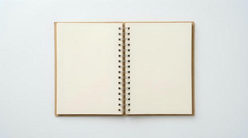 Open blank notebook with spiral binding on white background for writing notes and planning projects.