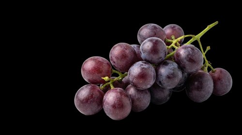 Fresh red grapes bunch isolated on transparent background, ready for stickers, T-shirt design, print on demand, clipart, and sublimation projects.