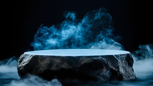 Dramatic stone platform with rising blue smoke against dark background creates mysterious atmosphere for product display or creative composition.