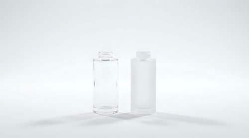 Clear glass and white plastic bottles on clean white background for product photography and packaging design mockups.
