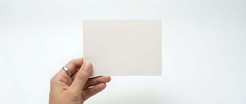 Hand holding blank white card mockup template for business presentation design on clean background.