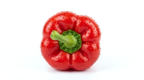 Fresh red bell pepper with green stem isolated on white background, suitable for food, cooking, nutrition, and culinary design projects.