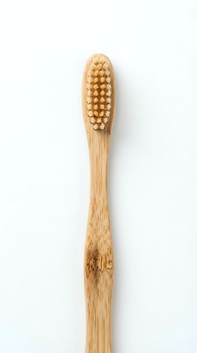 Natural bamboo toothbrush with soft bristles isolated on white background for eco-friendly dental care and sustainable oral hygiene products.