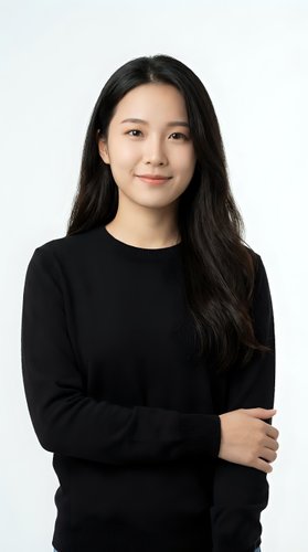 Professional Asian businesswoman in black sweater with crossed arms smiling confidently on white background for corporate headshot and business marketing.
