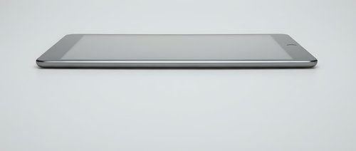 Modern silver laptop computer closed on white background isolated for technology and business presentations.