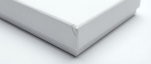 White blank cardboard box corner detail on clean background for packaging mockup and product presentation design projects.
