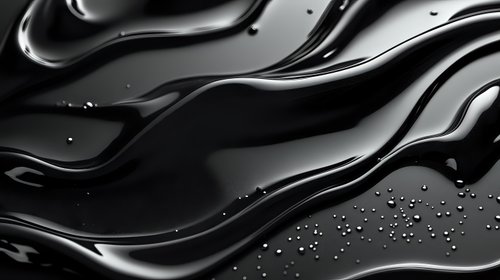 Sleek black liquid waves with water droplets creating dynamic abstract pattern on dark surface.