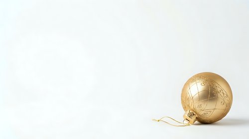 Golden globe ornament with twine string on neutral background, suitable for holiday decorations, seasonal marketing, and festive design projects.