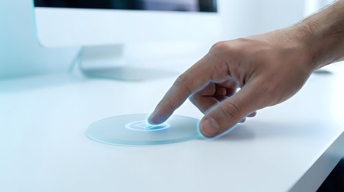 Male hand touching glowing futuristic holographic interface on white desk, digital fingerprint scan, biometric security technology concept.