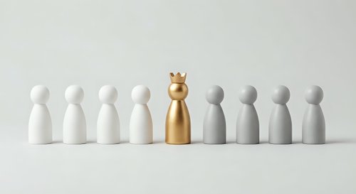 Golden pawn figure with crown stands out among white and gray wooden pieces on neutral background representing leadership and uniqueness in business.
