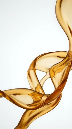 Flowing golden liquid oil isolated on white background, suitable for cosmetics, skincare, and wellness product design applications.