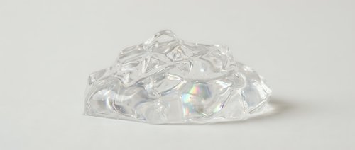 Clear crystal diamonds pile scattered on white background isolated for jewelry design and luxury concept projects.