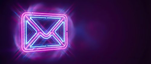 Glowing neon email envelope icon with bright pink and blue lights on dark background for digital communication and marketing design concepts.